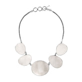 Handcrafted silver necklace with oval Mother of Pearl shell links in elegant artisan design.